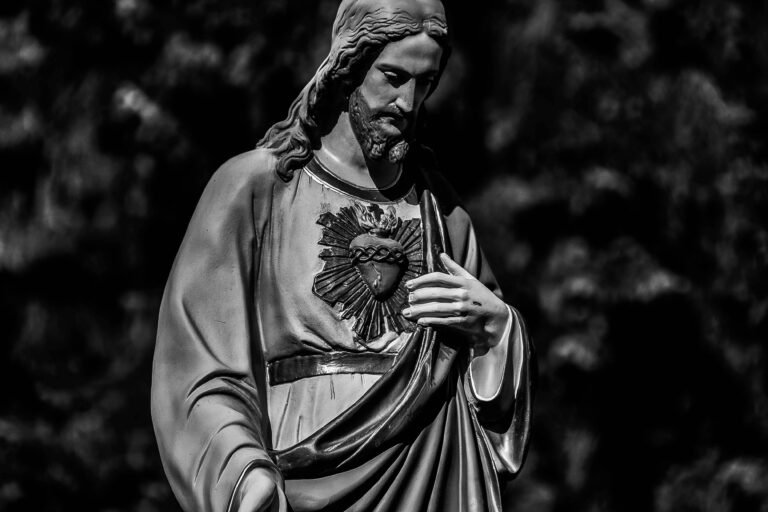 Black and white photo of a Sacred Heart of Jesus statue in Garwolin, Poland.